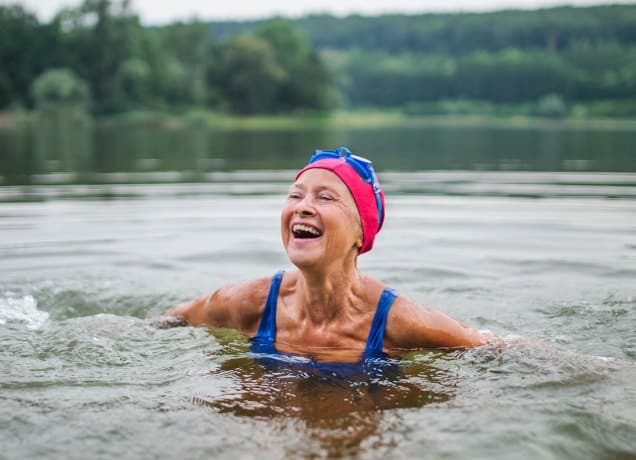 how to take care of hair after swimming a photo of a woman in a lake