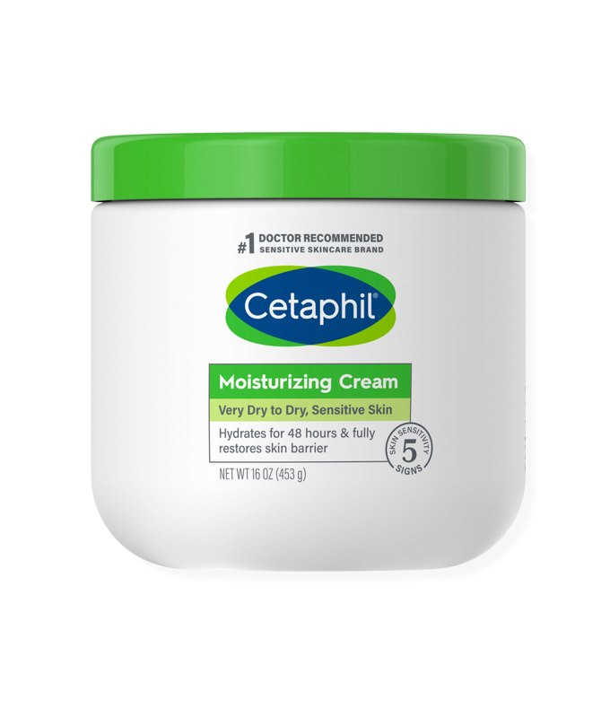 10 Products for Sensitive Skin - A white cylindrical container of Cetaphil moisturizing cream. It has a green and blue label and a green cap. The product is featured on a white background.