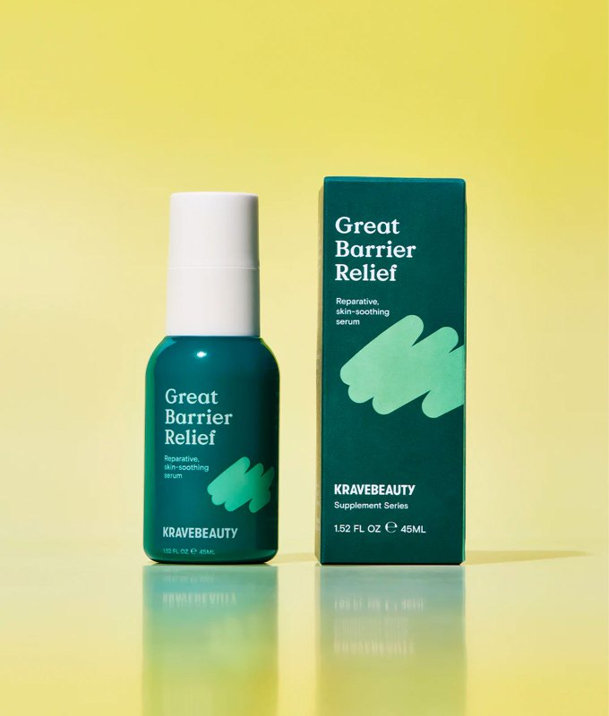 10 Products for Sensitive Skin - A dark green bottle of Krave Beauty serum next to the matching dark green packaging. The bottle has a white cap and a light green label. Both products are next to each other in front of a yellow background.