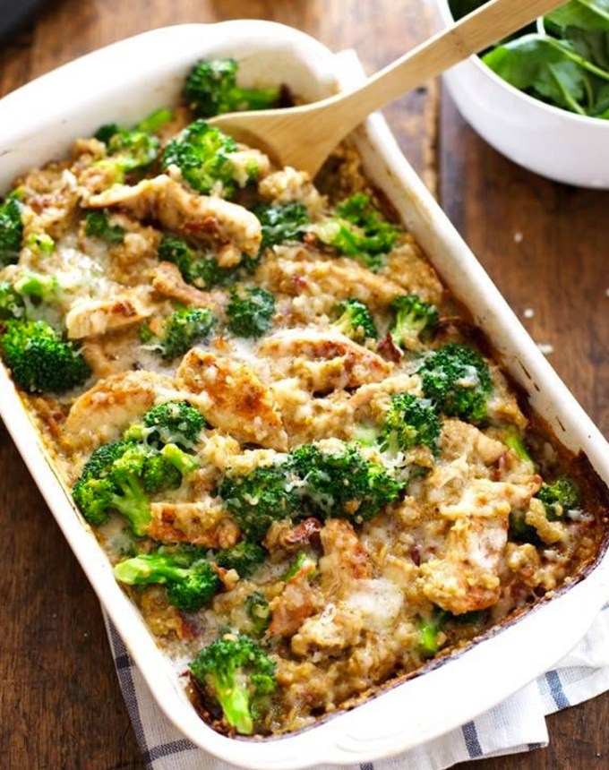 best big-batch recipes: chicken quinoa broccoli casserole in a baking dish with a serving spoon