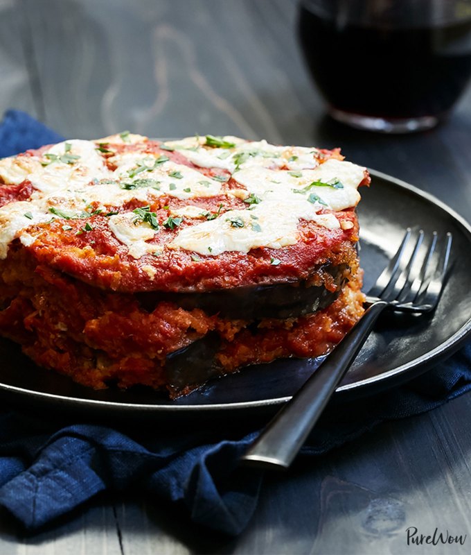 best big-batch recipes: stack of eggplant parm casserole on a plate with a fork