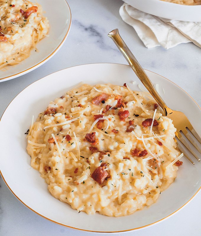 best big-batch recipes: plate of instant pot risotto carbonara with a fork