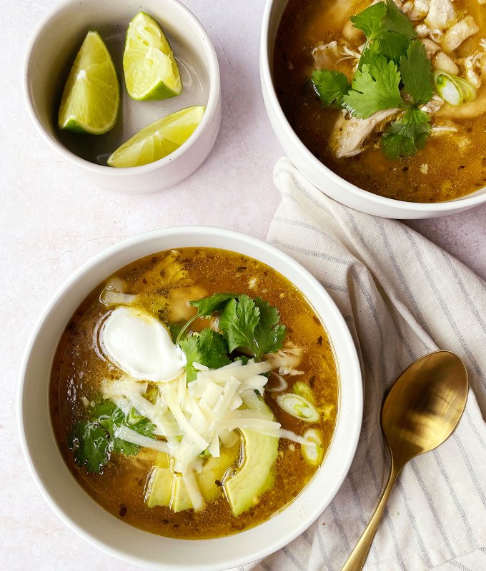 best big-batch recipes: two bowls of spicy green chicken chili made in the slow cooker