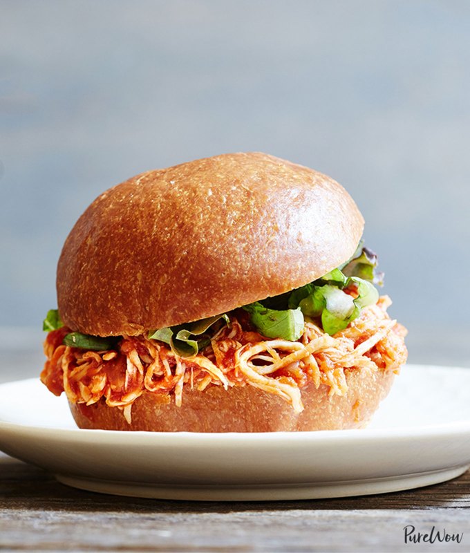 best big-batch recipes: close-up of slow cooker pulled chicken sandwich on a plate