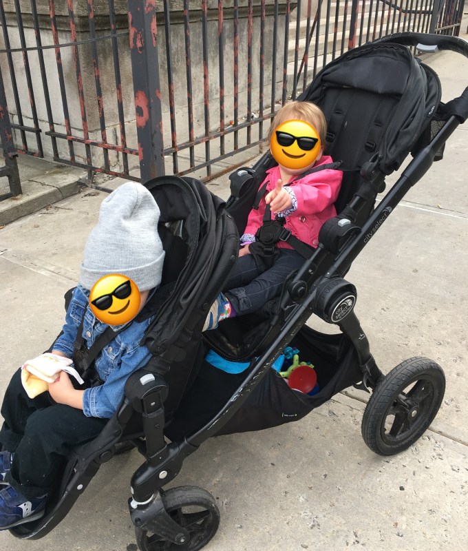 A family with a Disney-approved Baby Jogger double stroller.