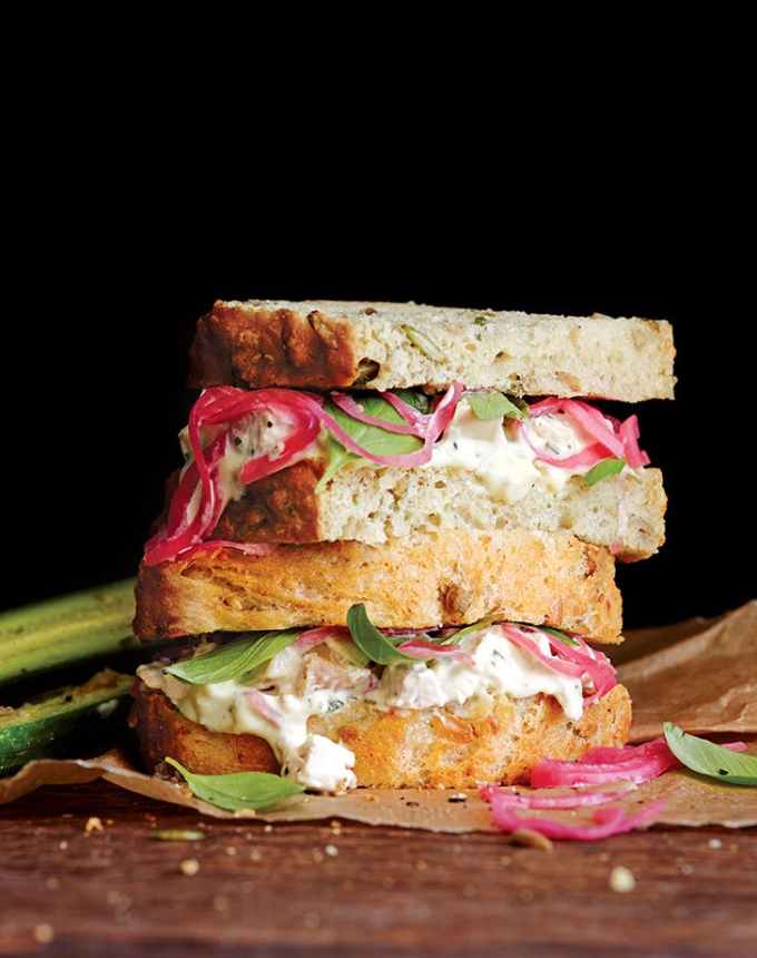 easy lunch ideas: stack of tarragon chicken salad sandwiches with pickled onions