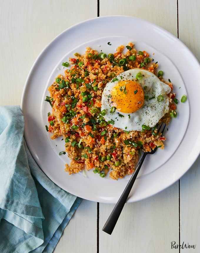 easy lunch ideas: cauliflower fried rice on a plate with a fried egg