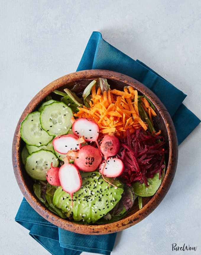 easy lunch ideas: aerial of radish bbq bowl with avocado and shredded carrot