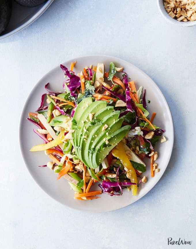 easy lunch ideas: aerial of shredded thai salad with avocado on a plate