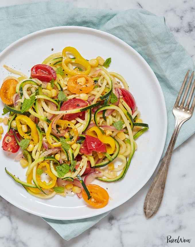 easy lunch ideas: plate of summer vegetable zoodles with a linen and fork