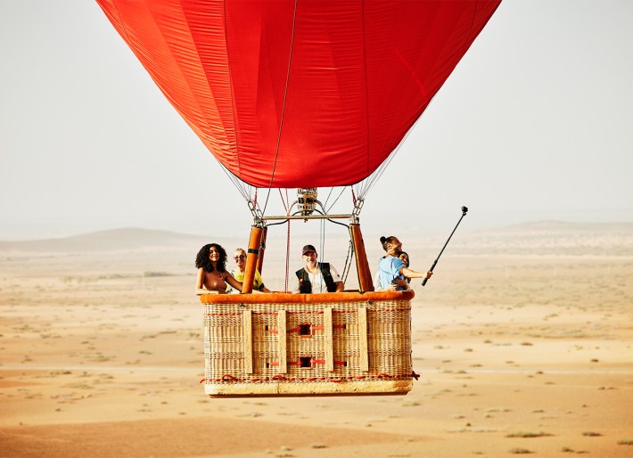 A close up of people in a hot air ballon.