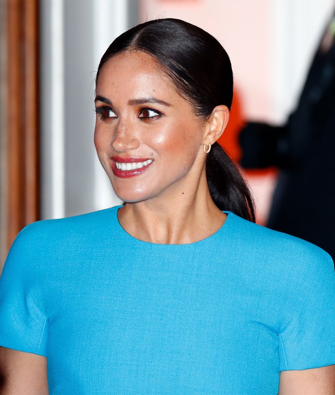 fall hair trends a photo of meghan markle in a sleek low ponytail