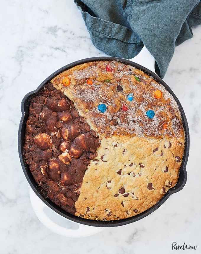 fun things to bake: aerial of a skillet cookie split into snickerdoodle, chocolate chip and s'mores varieties