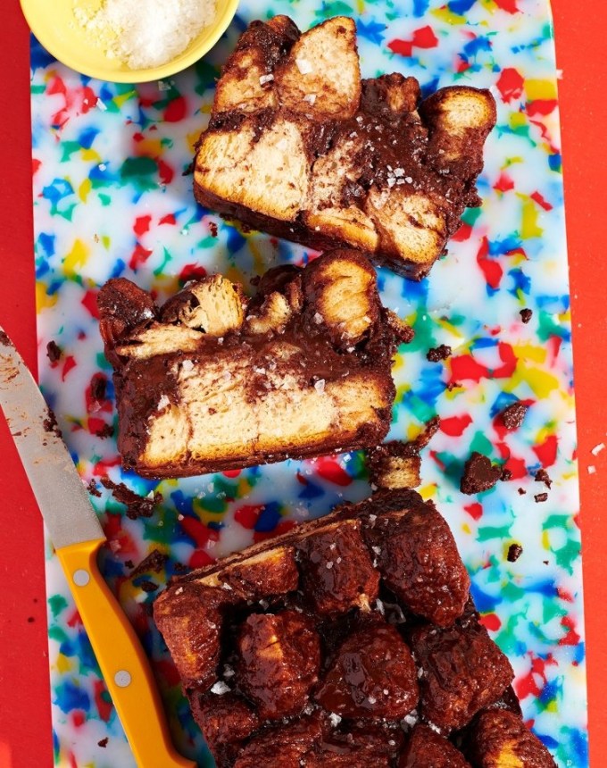 fun things to bake: babka-ish monkey bread on a speckled rainbow cutting board, sliced