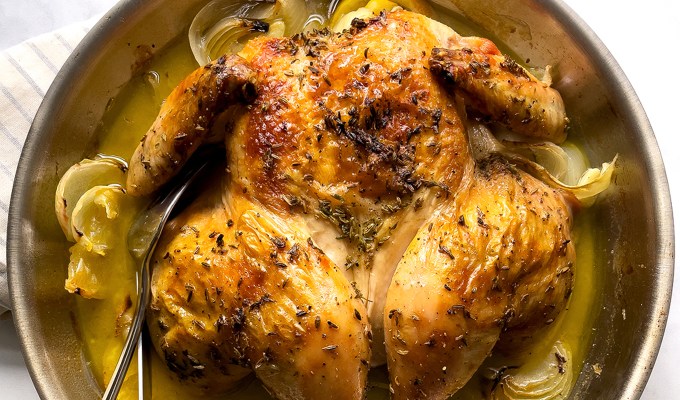 Ina Garten cooking tips: an overhead view of a roast chicken in a skillet