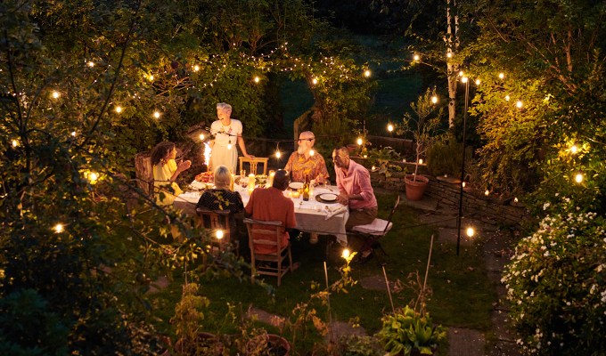 Labor Day menu: people having a dinner party outside