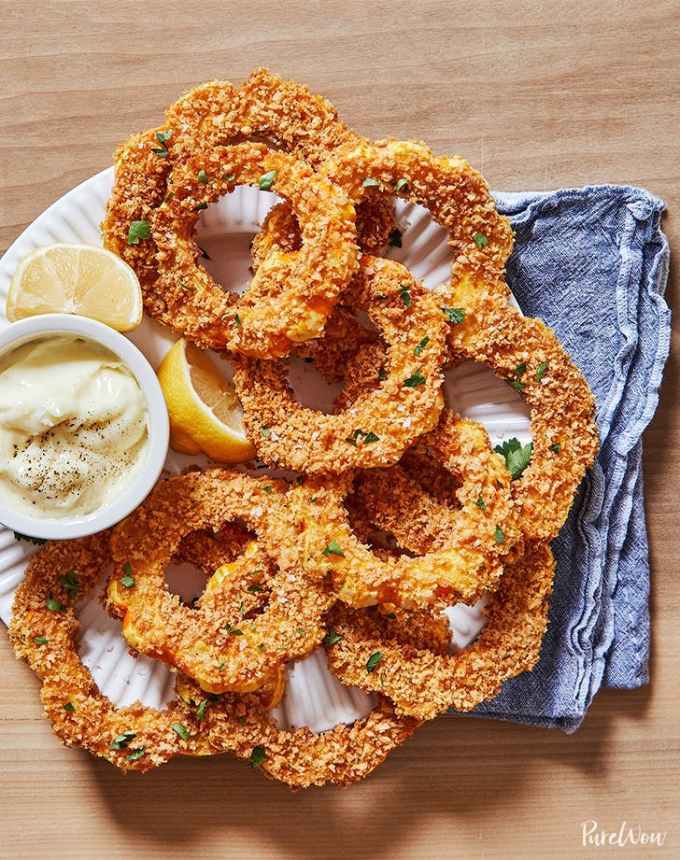 best big-batch recipes: crispy breaded delicata squash rings on a plate with aioli for dipping