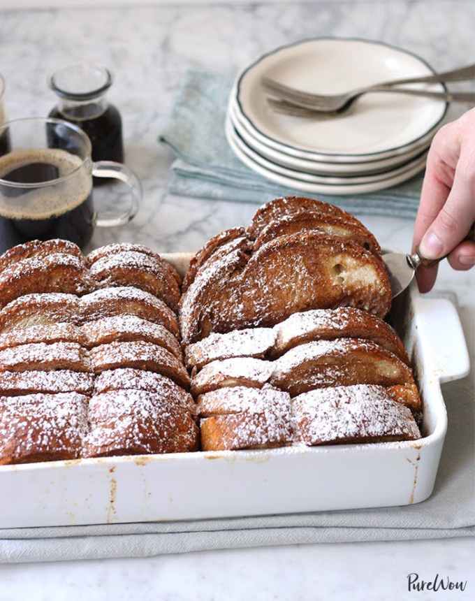 best big-batch recipes: casserole dish full of french toast, with a stack of plates in the background