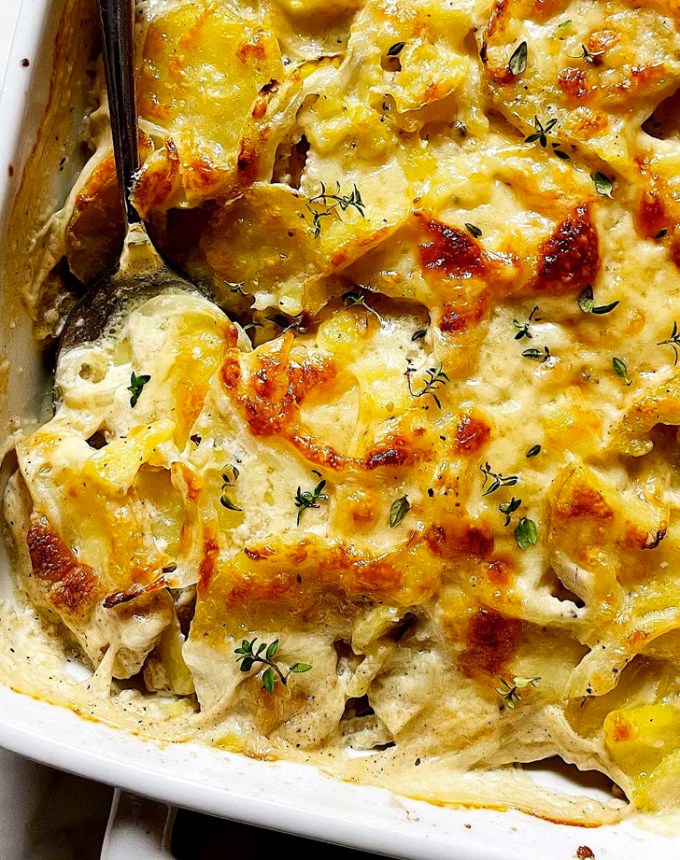 best big-batch recipes: close-up of potatoes au gratin in a baking dish