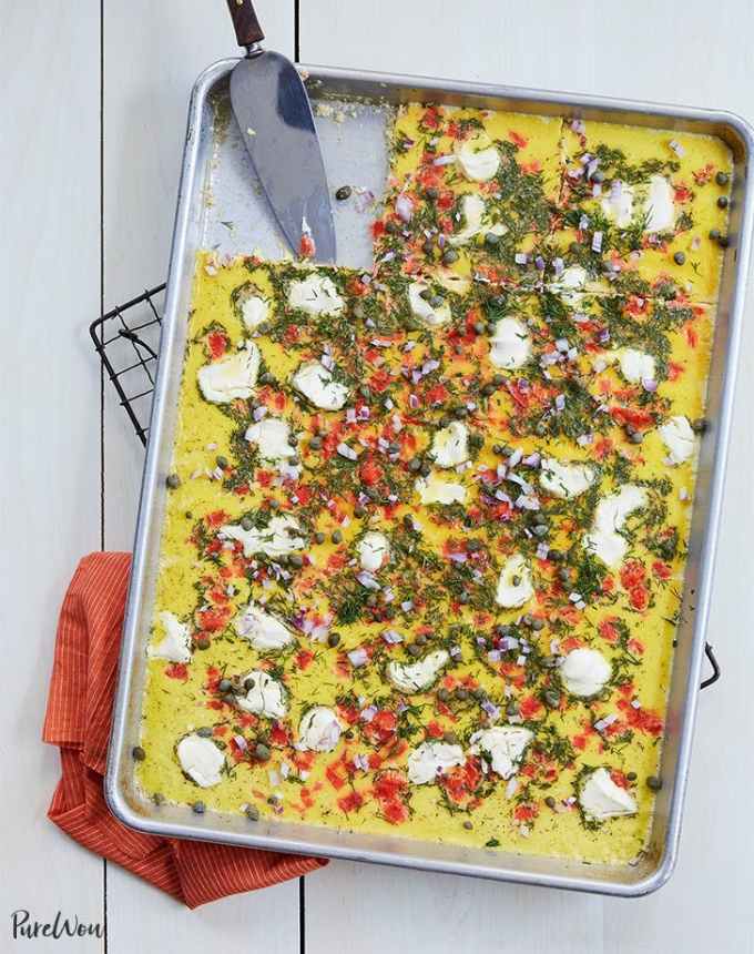 best big-batch recipes: sheet pan smoked salmon eggs topped with dollops of cream cheese and herbs