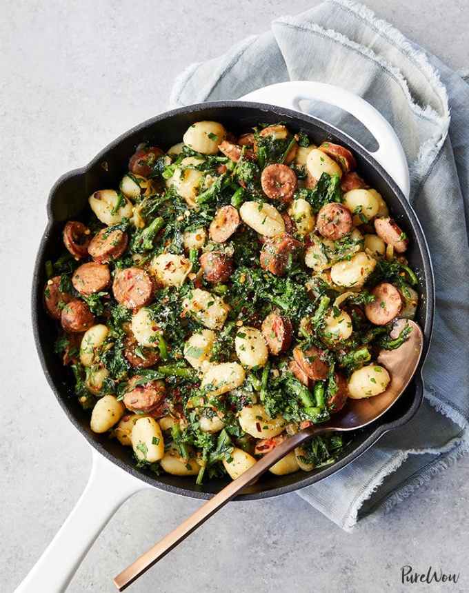 best big-batch recipes: skillet of broccoli rabe-sausage gnocchi atop a gray linen