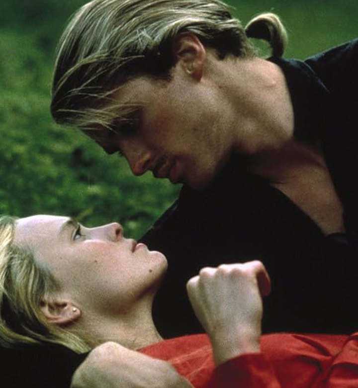 boy-mom-princess-bride-theory: A photograph of the main couple from The Princess Bride laying in the forest. The man is on top of the woman on some moss.