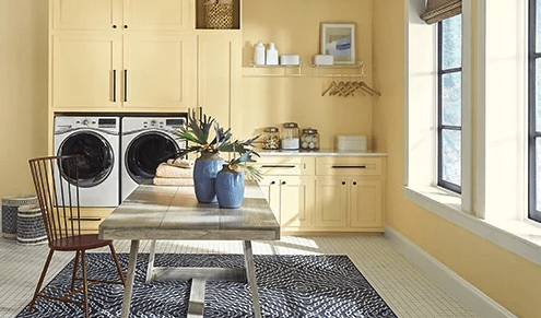 butter yellow laundry room in HGTV Home by Sherwin-Williams's Friendly Yellow