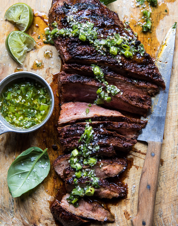 best big-batch recipes: korean grilled steak with toasted sesame chimichurri on a cutting board